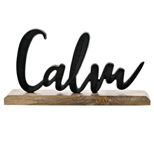 Metal “Calm” Sign on Wooden Base